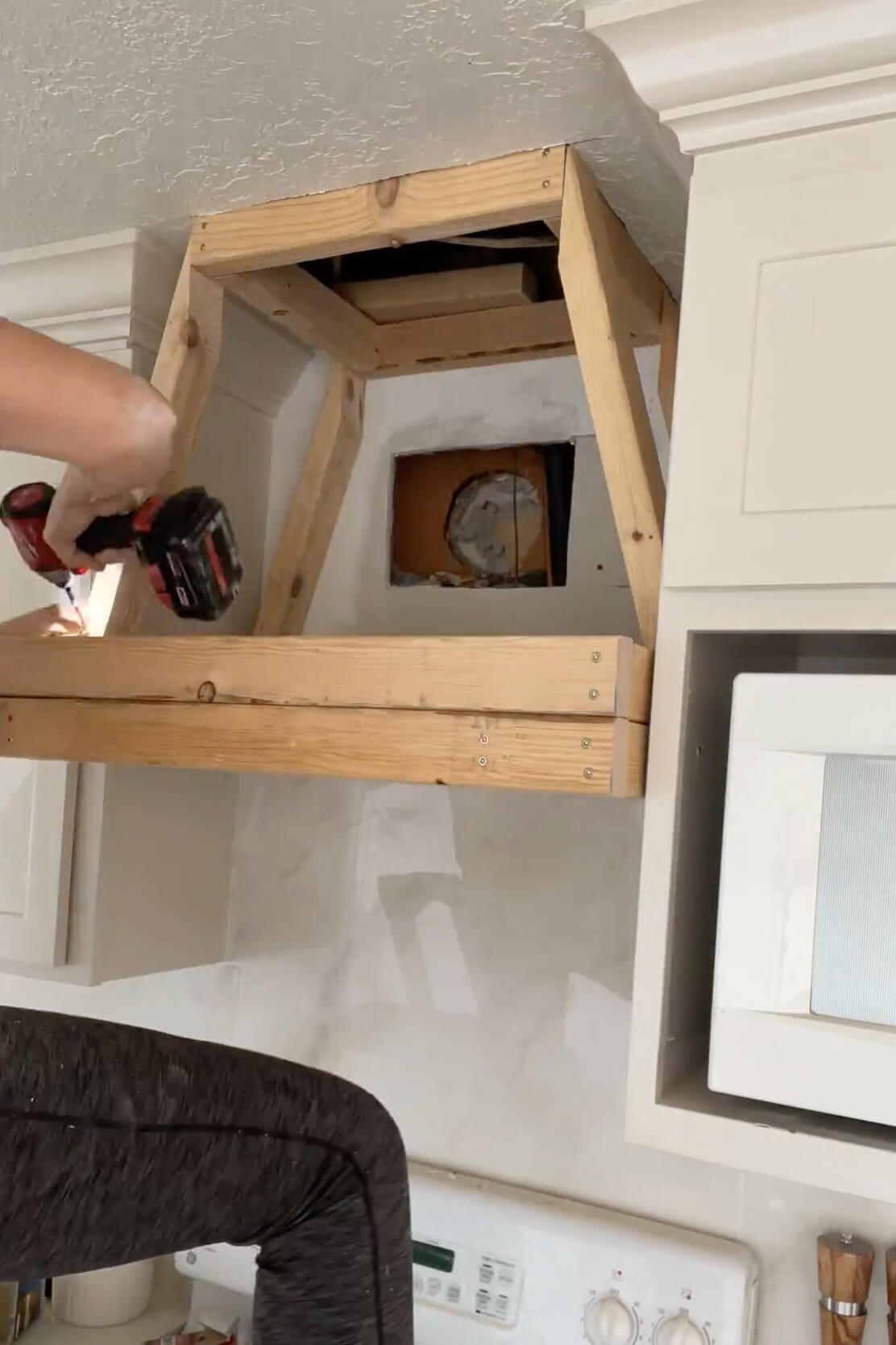 Framing a DIY range hood cover.